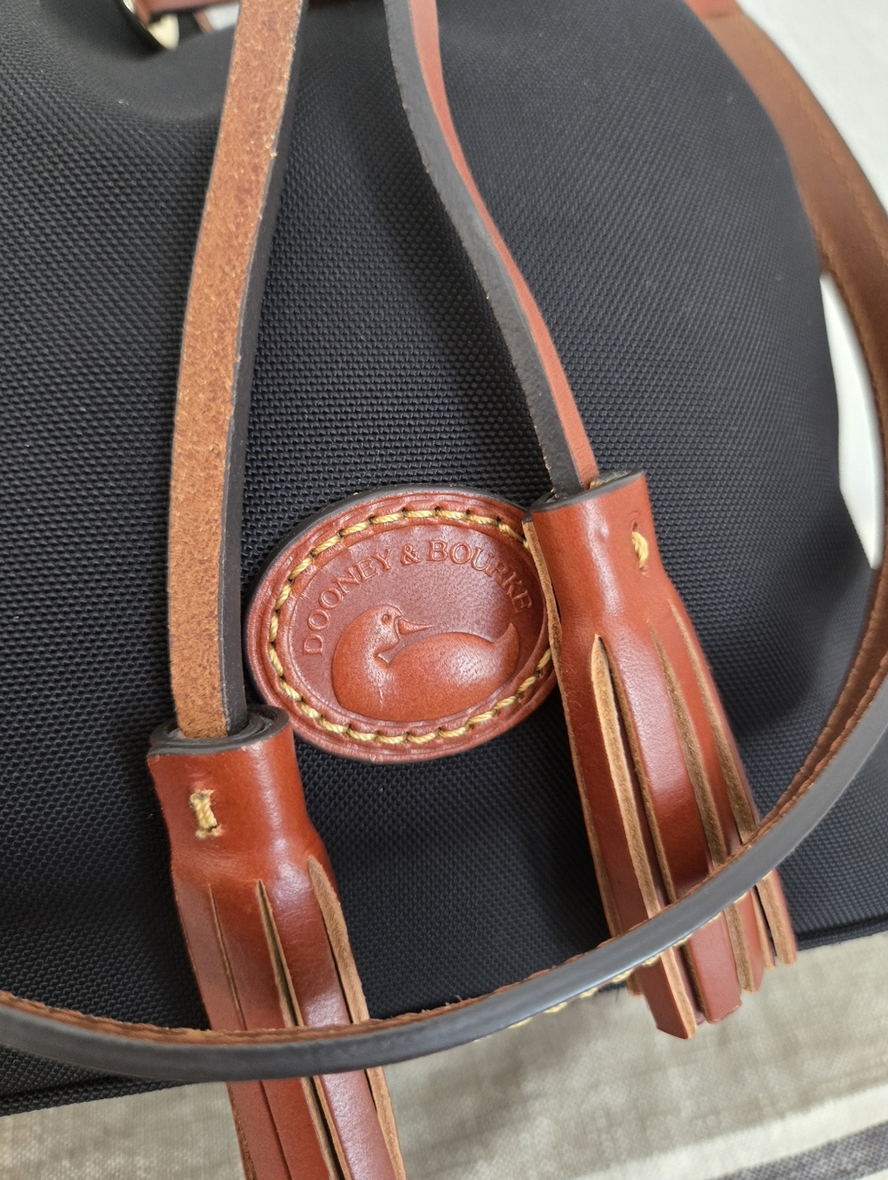 Dooney & Bourke Black Nylon Bucket Bag with Brown Trim and Tassels - Picture 4 of 16
